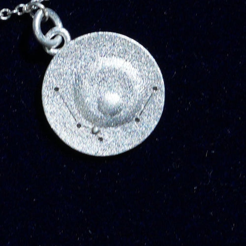 Coin of AV-0011, engraved with the Aquarius constellation, close up