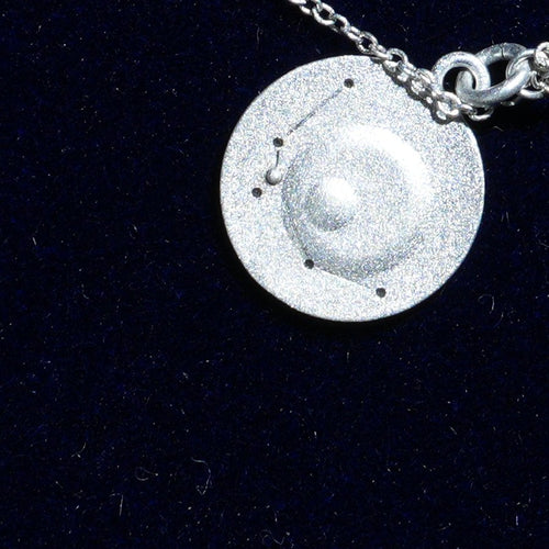 Coin of AV-0022, engraved with the Aquarius constellation, close up