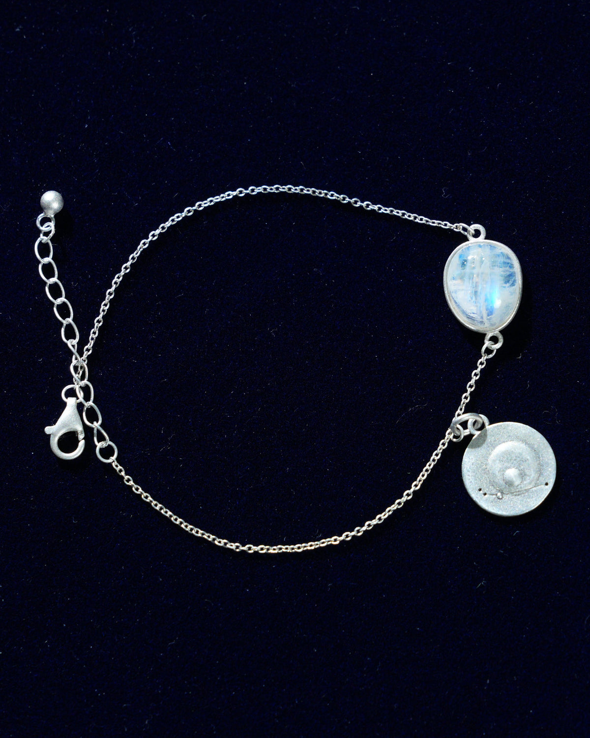 Moonstone bracelet AV-0001, Aries, on navy velvet