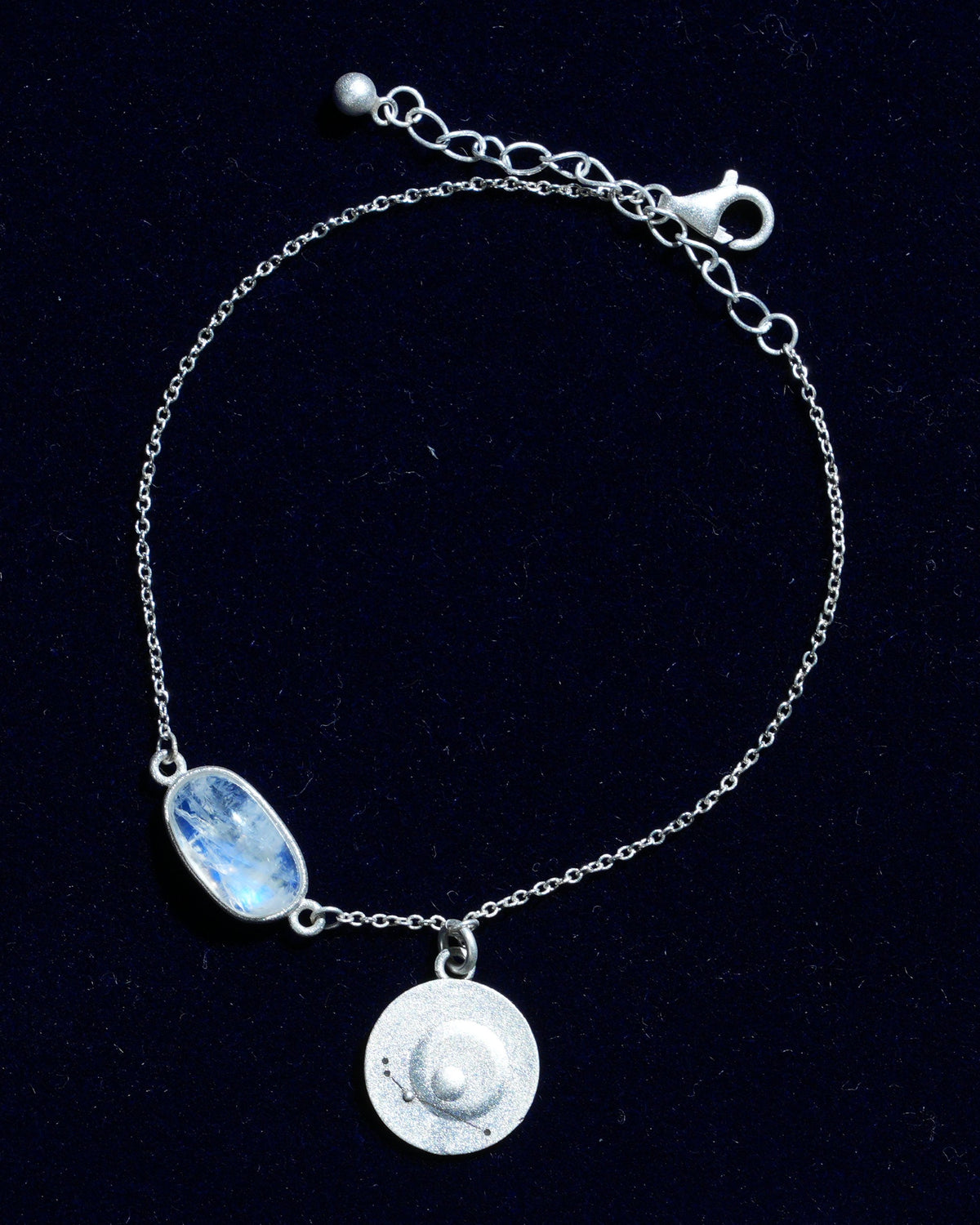 Moonstone bracelet AV-0027, Aries, on navy velvet