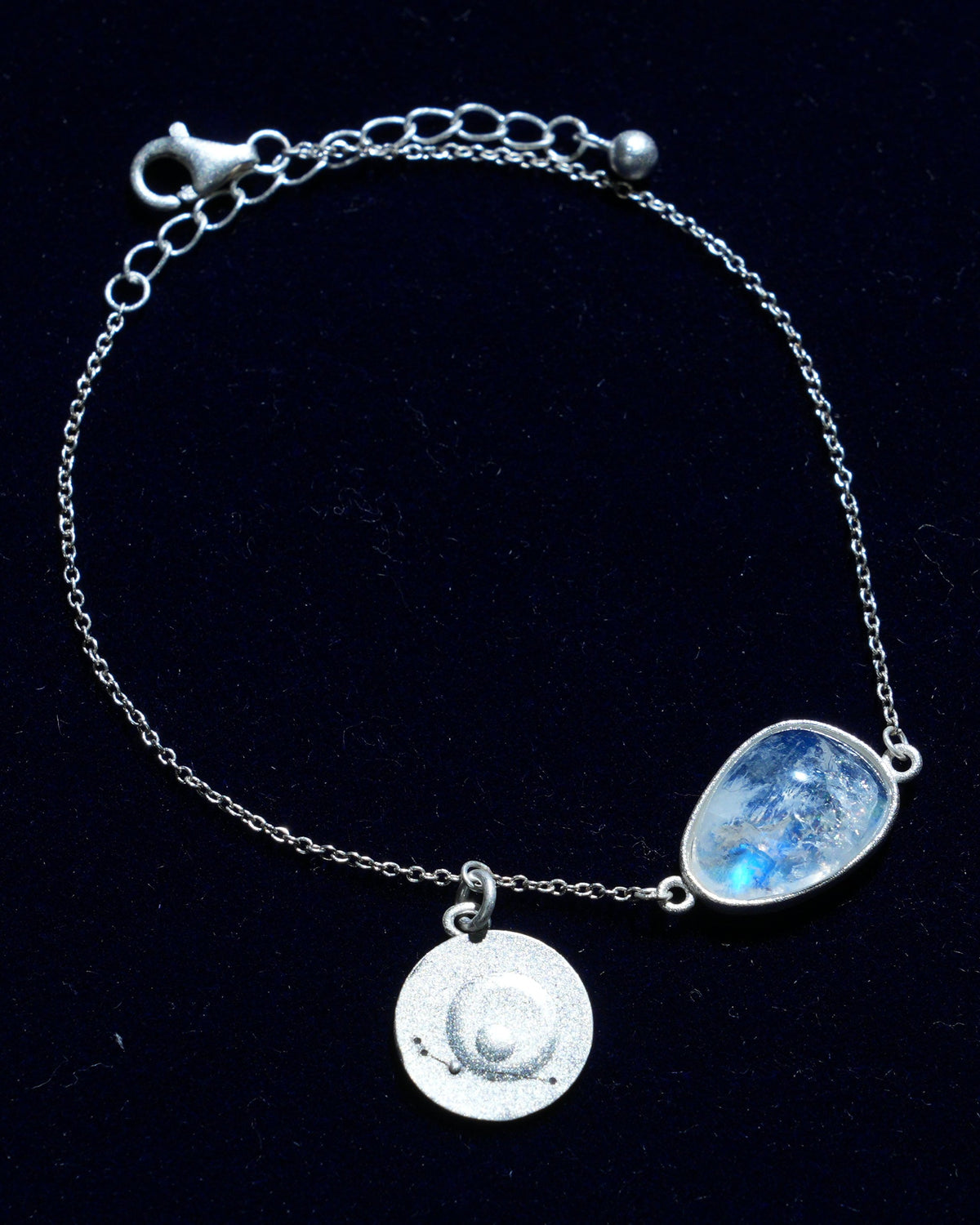 Moonstone bracelet AV-0028, Aries, on navy velvet