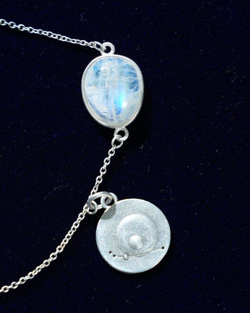 Rainbow moonstone and constellation coin of AV-0001, Aries, close up