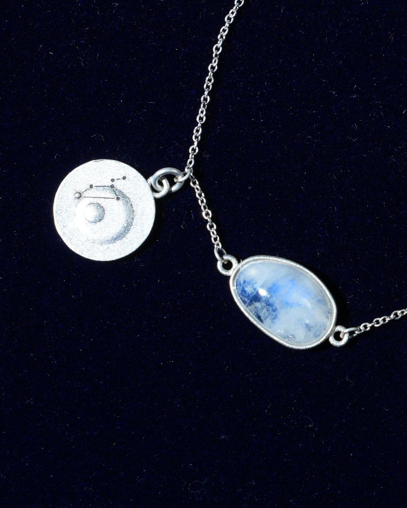 Rainbow moonstone and constellation coin of AV-0005, Leo, close up
