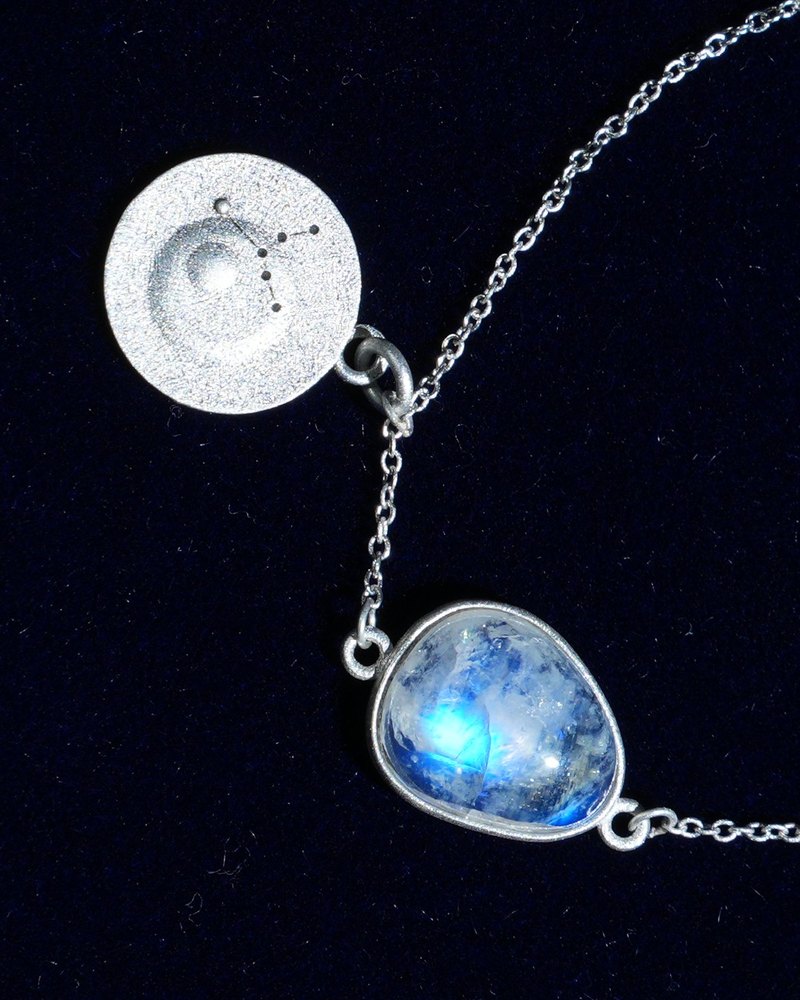 Rainbow moonstone and constellation coin of AV-0017, Virgo, close up