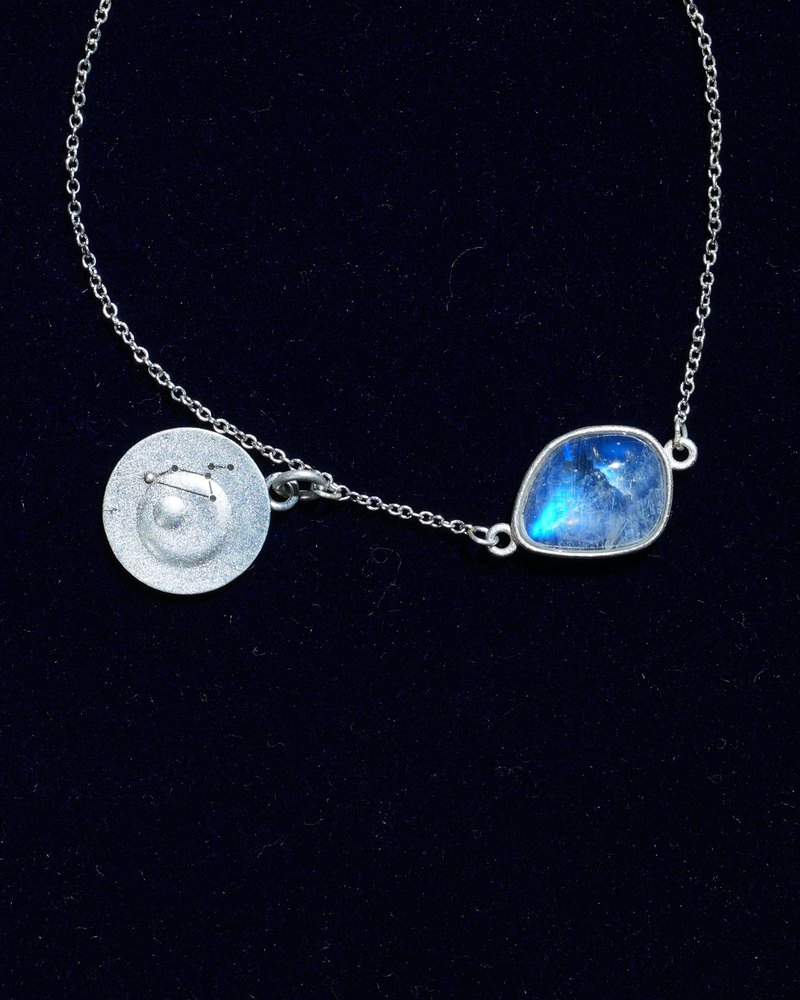 Rainbow moonstone and constellation coin of AV-0020, Leo, close up