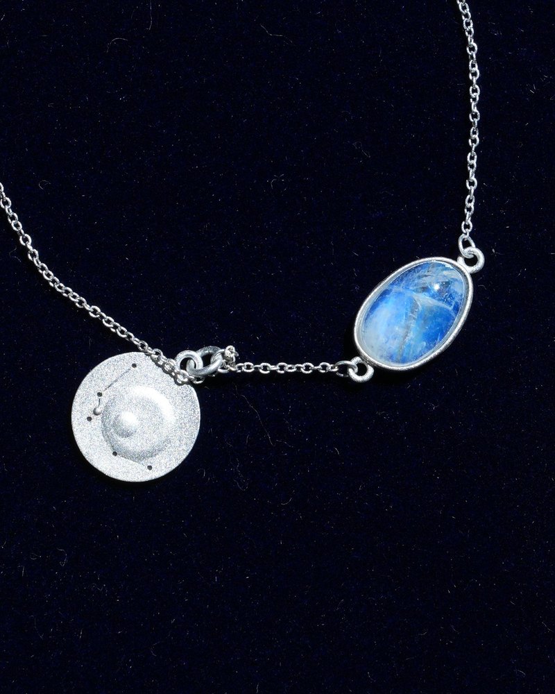 Rainbow moonstone and constellation coin of AV-0022, Aquarius, close up