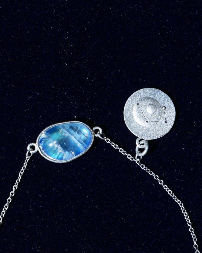 Rainbow moonstone and constellation coin of AV-0023, Libra, close up