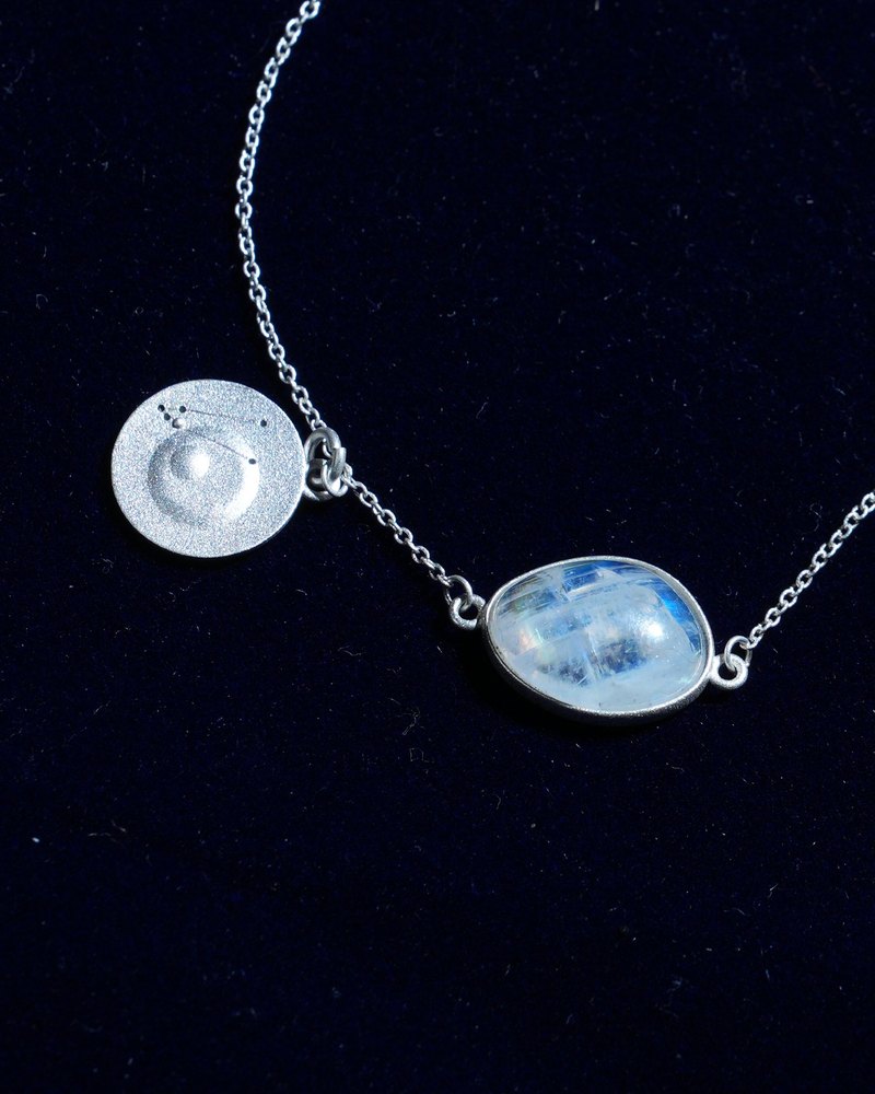 Rainbow moonstone and constellation coin of AV-0029, Taurus, close up