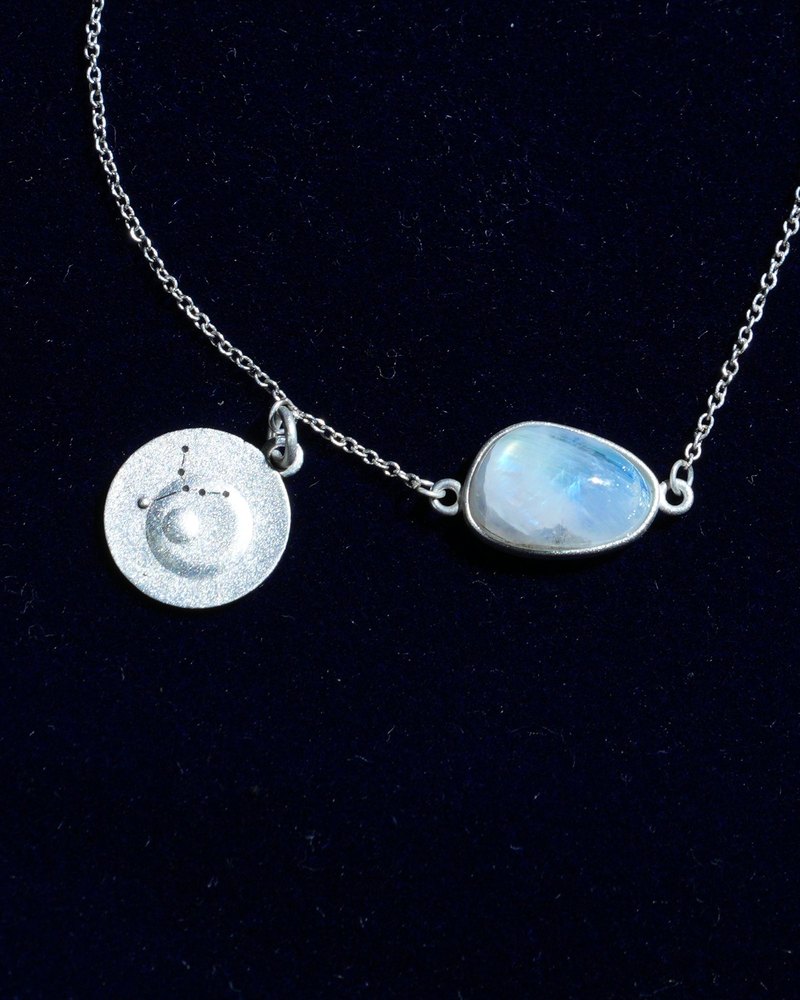 Rainbow moonstone and constellation coin of AV-0030, Virgo, close up
