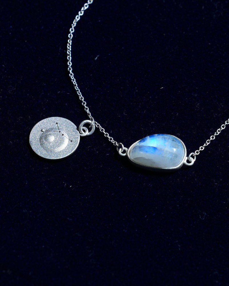 Rainbow moonstone and constellation coin of AV-0037, Cancer, close up