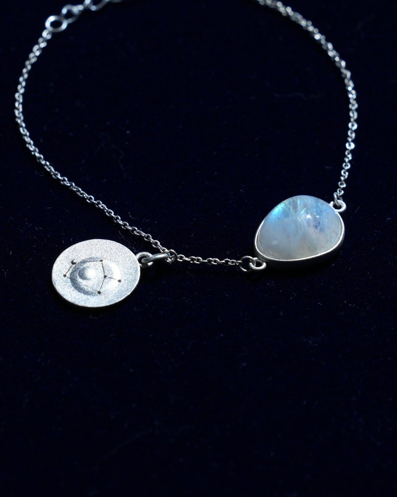 Rainbow moonstone and constellation coin of AV-0040, Sagittarius, close up
