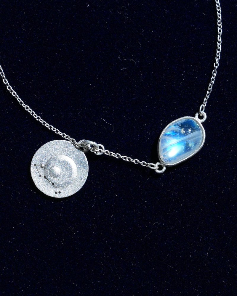 Rainbow moonstone and constellation coin of AV-0041, Scorpio, close up
