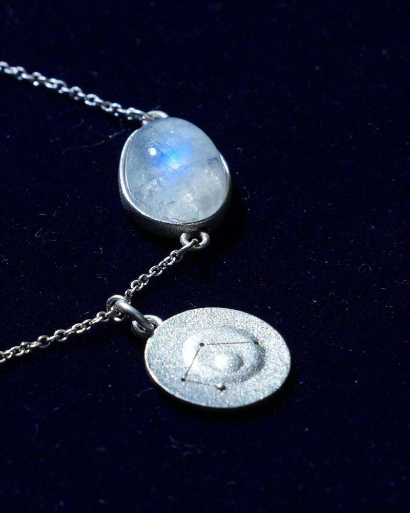 Rainbow moonstone and constellation coin of AV-0044, Libra, close up