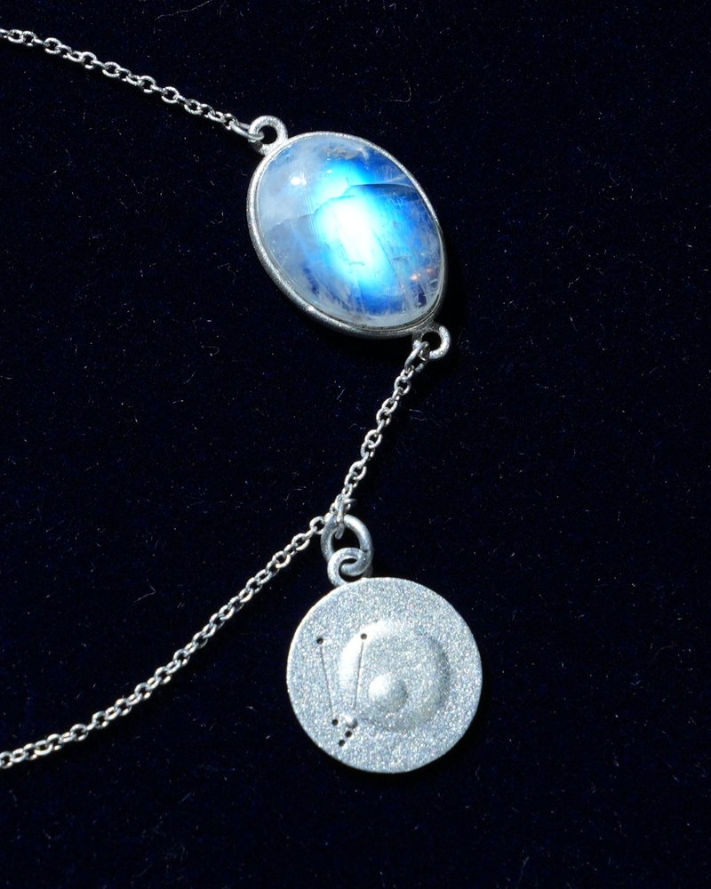 Rainbow moonstone and constellation coin of AV-0045, Taurus, close up