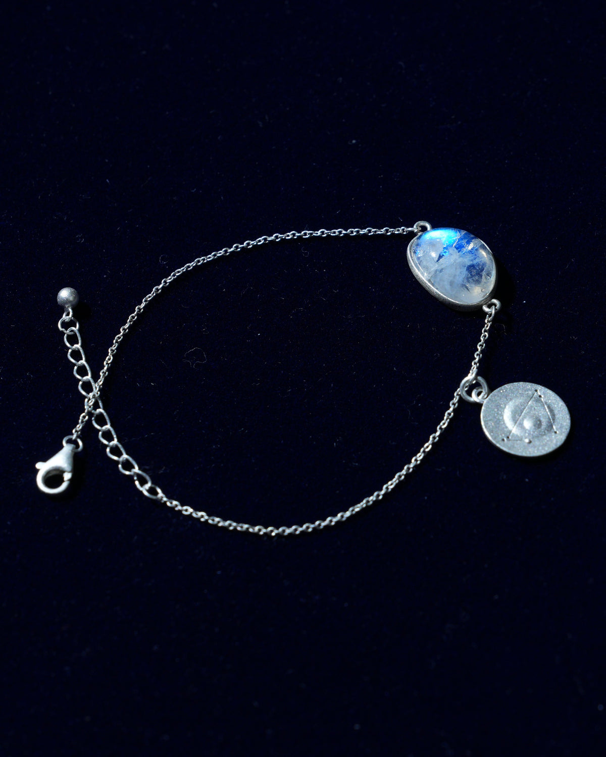 Moonstone bracelet AV-0034, Capricorn, on navy velvet