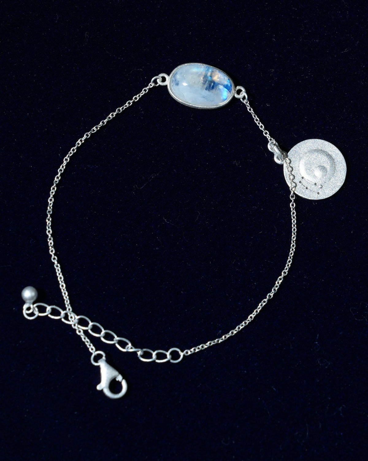 Moonstone bracelet AV-0003, Gemini, on navy velvet