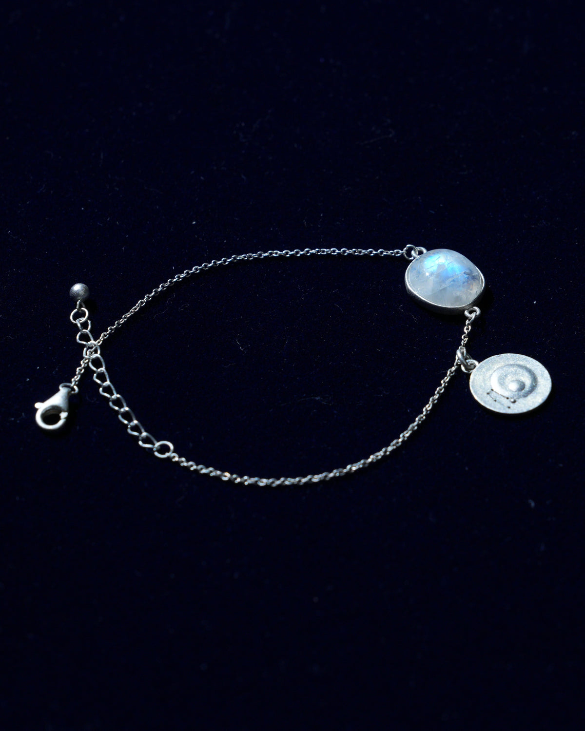 Moonstone bracelet AV-0039, Gemini, on navy velvet