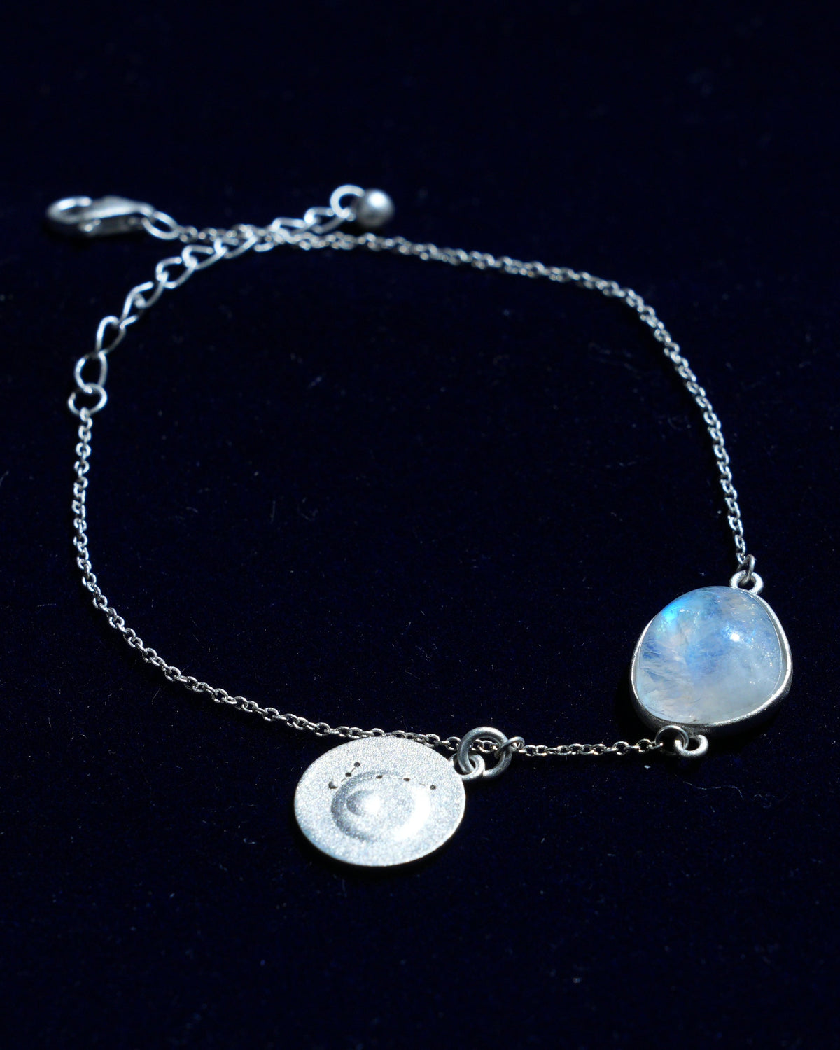 Moonstone bracelet AV-0032, Pisces, on navy velvet