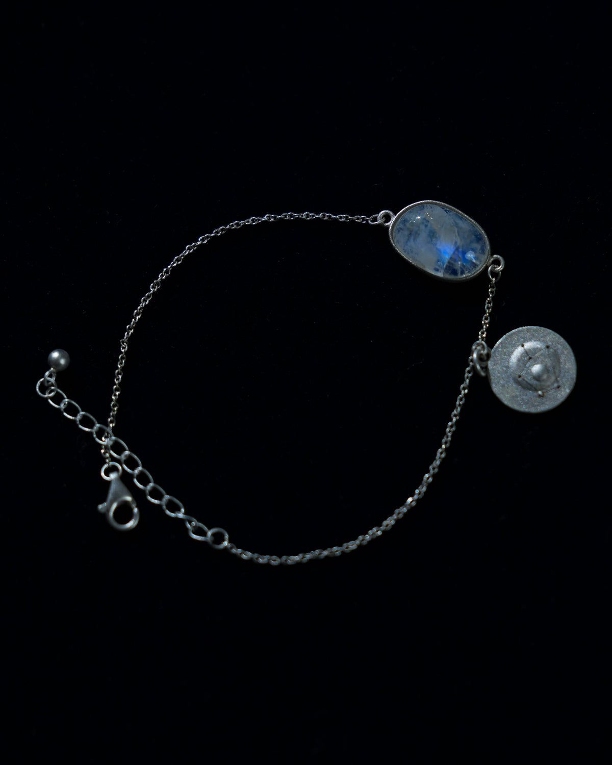 Moonstone bracelet AV-0009, Sagittarius, on navy velvet