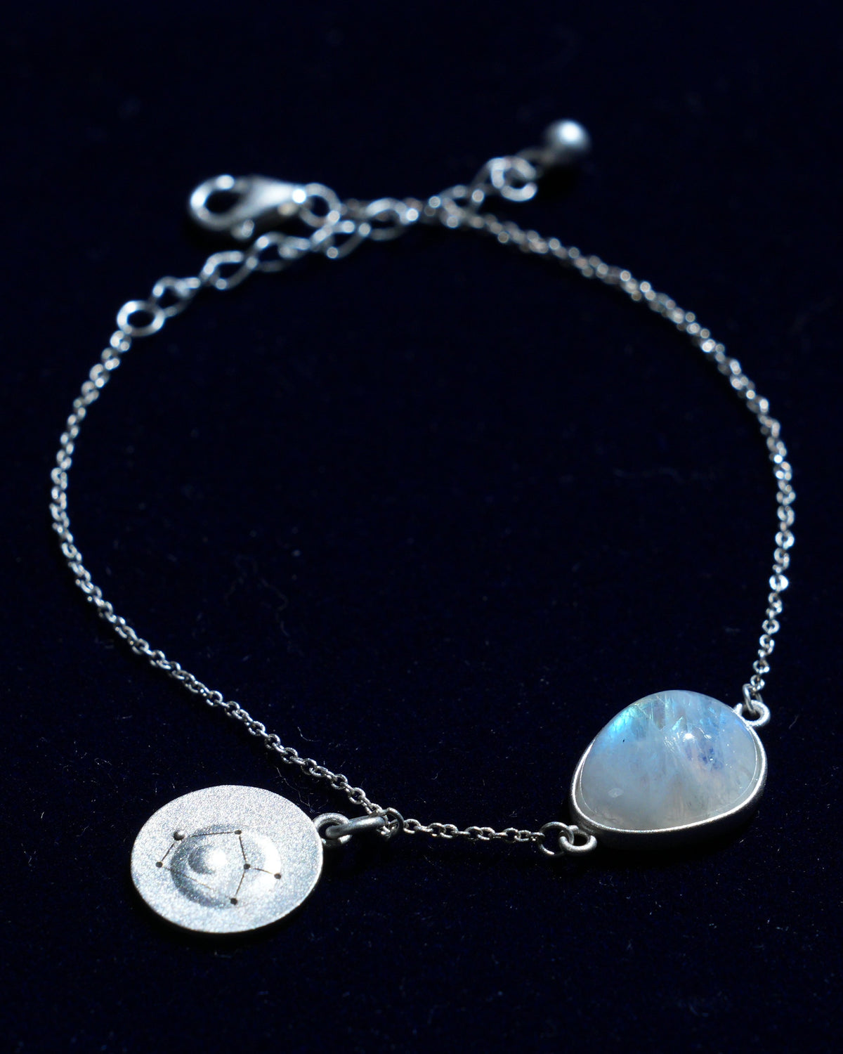 Moonstone bracelet AV-0040, Sagittarius, on navy velvet