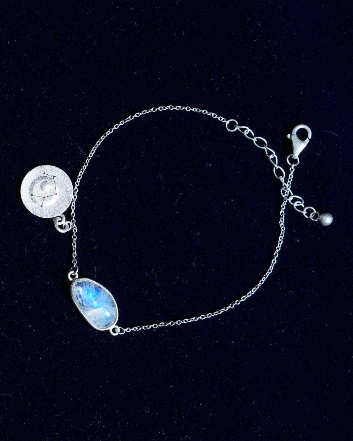 Moonstone bracelet AV-0042, Sagittarius, on navy velvet