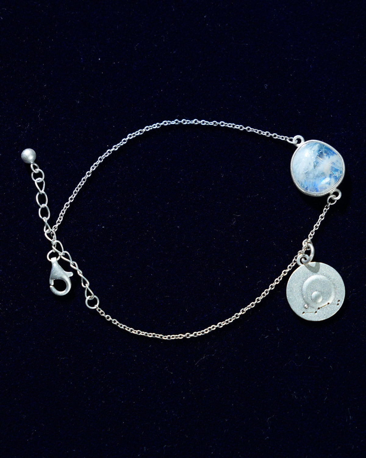Moonstone bracelet AV-0008, Scorpio, on navy velvet