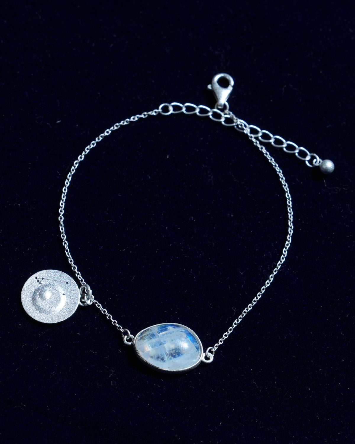 Moonstone bracelet AV-0029, Taurus, on navy velvet