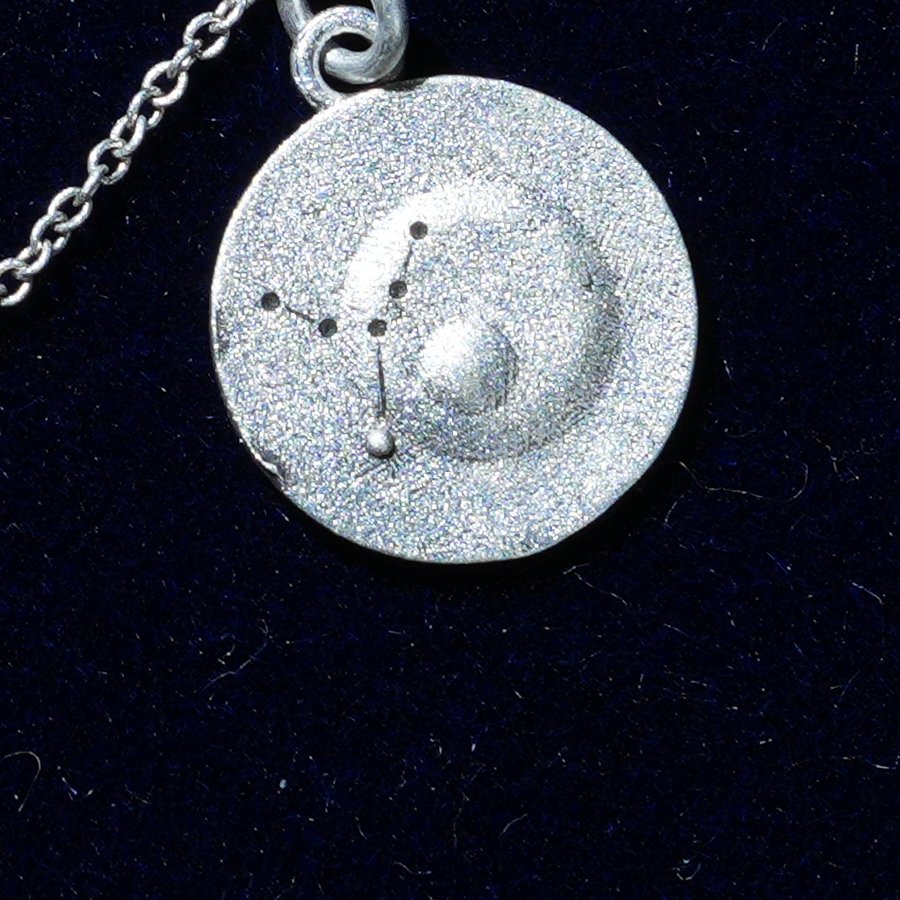 Coin of AV-0043, engraved with the Virgo constellation, close up